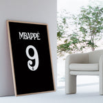 Load image into Gallery viewer, Kylian Mbappé Fodbold Plakat | Til Real Madrid Fans | Denne plakat viser Kylian Mbappé i en ikonisk Real Madrid trøje, klar til at score mål. Perfekt til fodboldfans og specielt Real Madrid entusiaster.