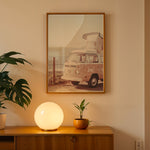 Load image into Gallery viewer, Plakat med vintage camper | Sommer og Strand Plakater | Denne plakat viser en vintage Volkswagen camper ved en kystlinje med hav og bjerge i baggrunden. Perfekt til camping- og roadtrip-entusiaster.
