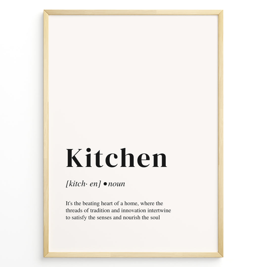 Minimalist kitchen definition poster with black text describing the kitchen as the heart of a home on a light background in a golden frame.