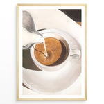 Load image into Gallery viewer, Coffee art print plakat showing milk being poured into a cup of espresso, creating a swirl pattern in a white cup on a saucer.

