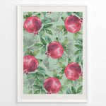 Load image into Gallery viewer, Watercolor botanical poster featuring red pomegranates with green leaves on a mint green background, framed in white.
