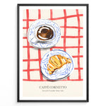 Load image into Gallery viewer, Italian breakfast poster with espresso and croissant on blue-patterned plates over a red checkered tablecloth, titled “Caffè Cornetto.”
