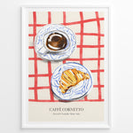 Load image into Gallery viewer, Italian breakfast poster with espresso and croissant on blue-patterned plates over a red checkered tablecloth, titled “Caffè Cornetto.”
