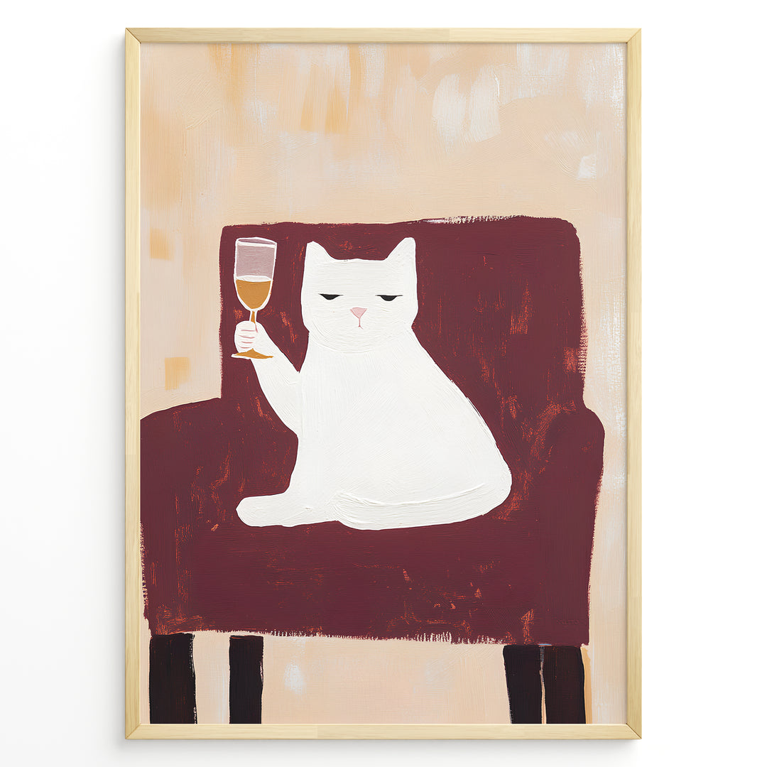 Funny cat art print plakat showing a white cat sitting on a maroon chair holding a wine glass, framed in black on a beige background.