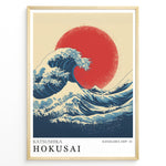 Load image into Gallery viewer, Hokusai-inspired illustration of a large blue wave with a red sun in a minimalist framed poster.
