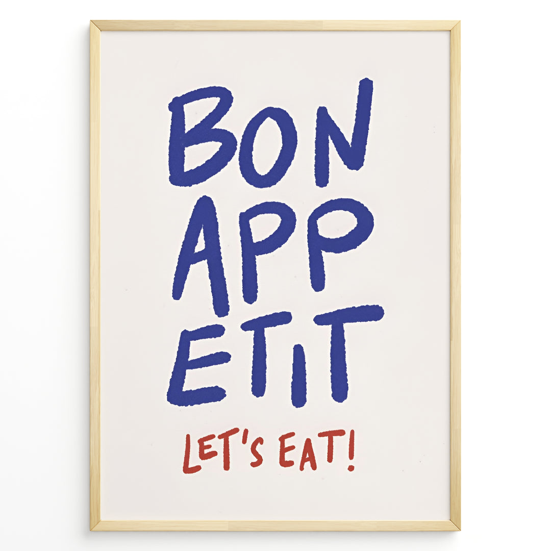 Minimalist poster with blue handwritten text “Bon Appétit” and red “Let’s Eat!” on a white background, framed in golden.