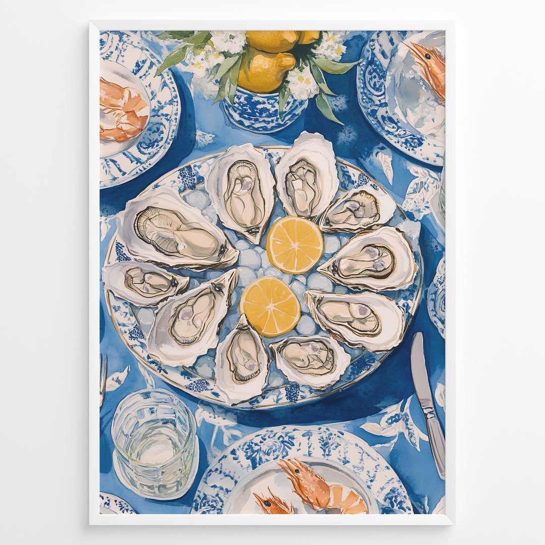 Oyster platter art print plakat showing oysters and lemon slices on a blue patterned table with seafood dishes and glassware in a White frame.