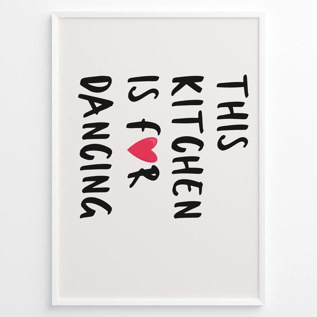Minimalist poster with text “This Kitchen Is for Dancing” and a red heart in black font, framed in white.