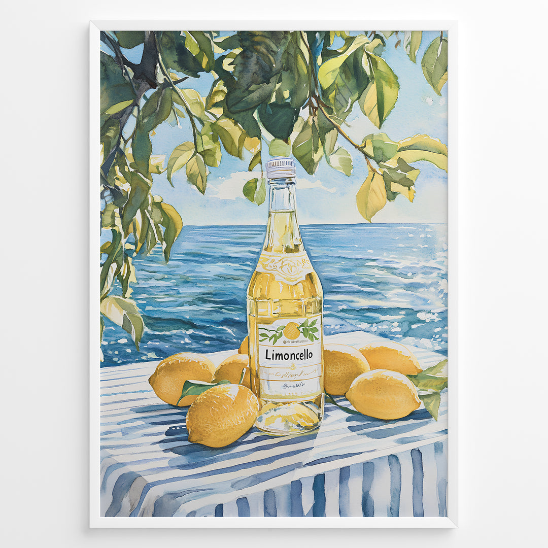 Limoncello art print plakat with a bottle of limoncello, lemons, and green leaves overlooking the blue sea on a striped tablecloth in a white frame.