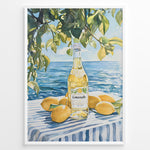 Load image into Gallery viewer, Limoncello art print plakat with a bottle of limoncello, lemons, and green leaves overlooking the blue sea on a striped tablecloth in a white frame.
