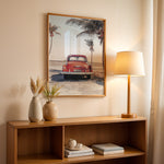 Load image into Gallery viewer, Plakat med vintage bil | Sommer og Strand Plakater | Denne plakat viser en vintage rød bil parkeret ved en strandvej med havet og palmetræer i baggrunden. Perfekt til dem, der elsker retro og strandstemning.
