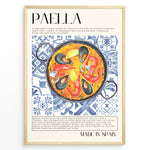 Load image into Gallery viewer, Watercolor paella wall art showing seafood, rice, and mussels on blue patterned tiles, framed in black, ideal for Spanish kitchen or restaurant wall decoration.
