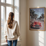 Load image into Gallery viewer, Plakat med vintage rød bil | Sommer og Strand Plakater | Denne plakat viser en klassisk rød cabriolet parkeret på en gade med palmer ved stranden. Perfekt til retro- og strandelskere.
