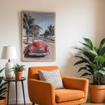 Load image into Gallery viewer, Plakat med vintage rød bil | Sommer og Strand Plakater | Denne plakat viser en klassisk rød cabriolet parkeret på en gade med palmer ved stranden. Perfekt til retro- og strandelskere.
