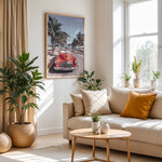 Load image into Gallery viewer, Plakat med vintage rød bil | Sommer og Strand Plakater | Denne plakat viser en klassisk rød cabriolet parkeret på en gade med palmer ved stranden. Perfekt til retro- og strandelskere.
