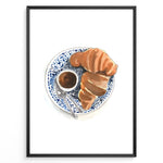Load image into Gallery viewer, Watercolor wall art of a croissant and espresso cup on a blue decorative plate, ideal for French café, kitchen, or breakfast nook wall décor.
