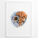 Load image into Gallery viewer, Watercolor wall art of a croissant and espresso cup on a blue decorative plate, ideal for French café, kitchen, or breakfast nook wall décor.
