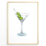 Load image into Gallery viewer, Watercolor illustration plakat of a martini glass with green olives—minimalist cocktail art print for kitchen or bar décor.

