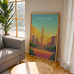 Load image into Gallery viewer, Buenos Aires Vintage Travel Plakat | Vintage Travel Poster | Denne plakat viser en illustration af et monument i Buenos Aires omgivet af moderne bygninger. Farverne går fra turkis til orange og gul, som skaber en livlig atmosfære.
