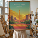 Load image into Gallery viewer, Buenos Aires Vintage Travel Plakat | Vintage Travel Poster | Denne plakat viser en illustration af et monument i Buenos Aires omgivet af moderne bygninger. Farverne går fra turkis til orange og gul, som skaber en livlig atmosfære.

