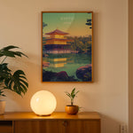 Load image into Gallery viewer, Kinkaku-ji Vintage Travel Plakat | Vintage Travel Poster | Denne plakat viser Den Gyldne Pavillon i Kyoto, Japan, med sin gyldne facade, omgivet af frodig natur og en rolig vandflade.
