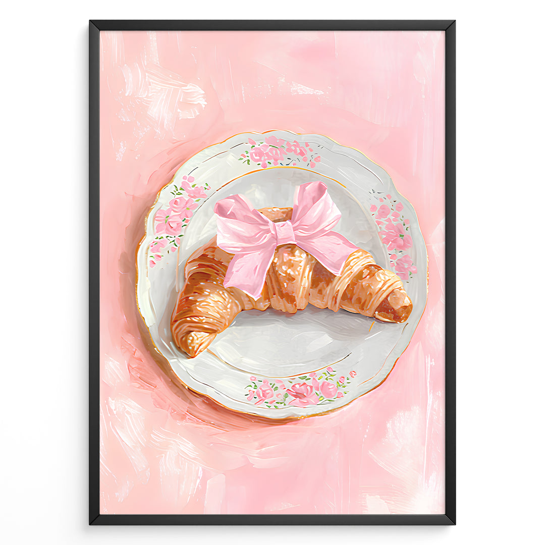 Illustrated croissant with a pink bow on a floral plate over a pink background.