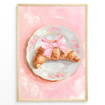 Load image into Gallery viewer, Illustrated croissant with a pink bow on a floral plate over a pink background.
