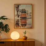 Load image into Gallery viewer, Plakat med Volkswagen surf van | Sommer og Strand Plakater | Denne plakat viser en orange Volkswagen van med surfbrætter på taget, parkeret på en våd overflade med refleksion af vanen i vandet. Perfekt til eventyrlystne sjæle og strandelskere.
