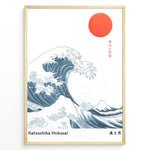 Load image into Gallery viewer, Minimalist Japanese art poster showing a large blue wave, red sun, and Mount Fuji, inspired by Hokusai’s Great Wave, framed in a black border.
