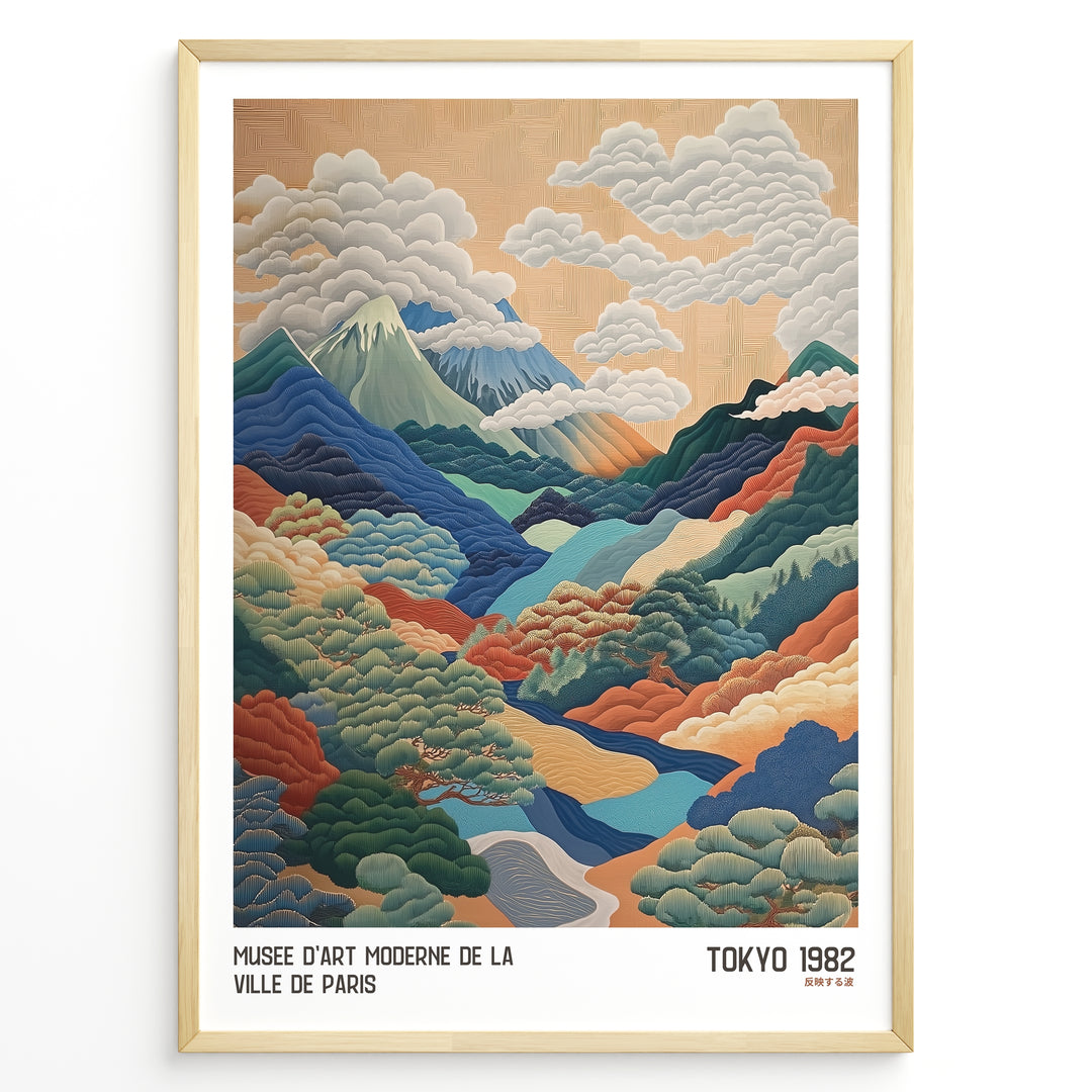 Vintage Japanese landscape poster with colorful layered mountains, clouds, and trees, framed in black, labeled “Tokyo 1982” and “Musée d’Art Moderne de la Ville de Paris.”