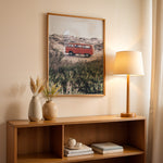 Load image into Gallery viewer, Plakat med vintage van i klitterne | Sommer og Strand Plakater | Denne plakat viser en rød vintage van parkeret på en sandsti omgivet af klitter og vegetation. Perfekt til nostalgikere og eventyrere.
