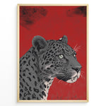 Load image into Gallery viewer, Illustrated leopard portrait with detailed spots and green eyes on a textured red background, framed in black.
