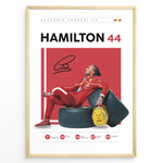 Load image into Gallery viewer, Framed Hamilton 44 Scuderia Ferrari F1 poster showing the driver in a red suit leaning on tires, holding a yellow helmet, with signature and career stats.
