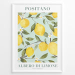 Load image into Gallery viewer, Positano lemon tree poster with yellow lemons, green leaves, and white flowers on a light blue background in a white frame.
