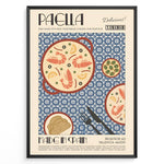 Load image into Gallery viewer, Vintage Spanish paella poster with illustrated pan of rice, prawns, and lemon slices on a blue patterned background in a black frame.
