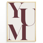 Load image into Gallery viewer, Minimalist typography wall art print plakat with the word “YUM” in large maroon letters on a cream background framed in black.
