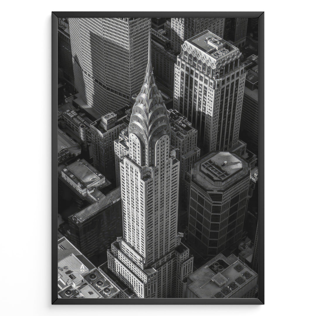 Fashion Plakat | Aerial View of the Chrysler Building in Black and White Plakaty.dk | Black and white aerial view of the Chrysler Building surrounded by New York City skyscrapers.