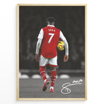 Load image into Gallery viewer, Poster featuring a football player in a red and white No. 7 jersey walking on a stadium field while holding a match ball, with a stylized signature at the bottom.
