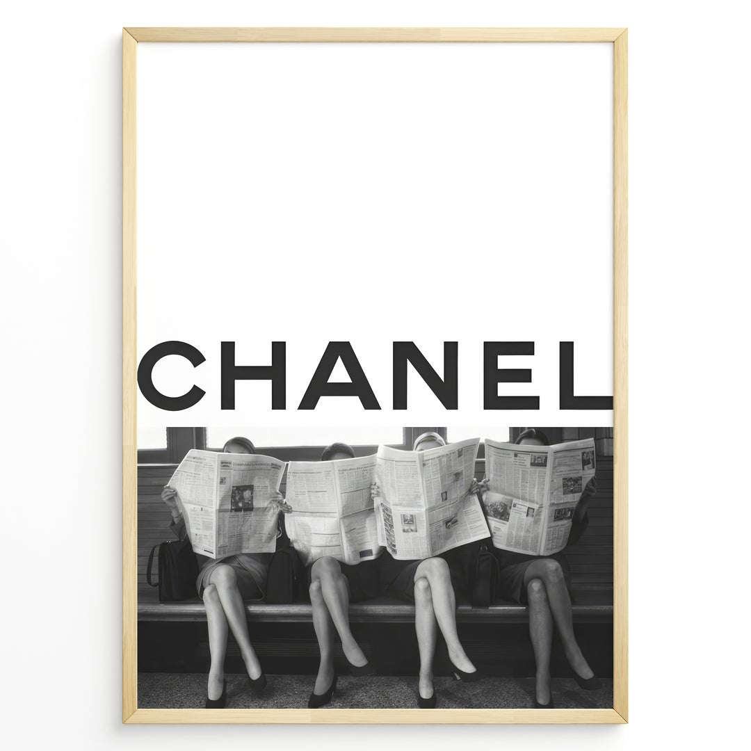 Fashion Plakat | CHANEL Newspaper Bench – Fashion Art Poster Plakaty.dk | Black and white fashion poster of four women sitting on a bench reading newspapers, with the bold text "CHANEL" across the top half of the image.