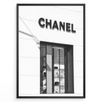 Load image into Gallery viewer, Fashion Plakat | Chanel Boutique Storefront – Minimalist Black and White Fashion Photography Plakaty.dk | Black and white photo of a Chanel storefront with window display showcasing handbags and luxury items
