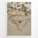 Load image into Gallery viewer, Fashion Plakat | Chanel No. 5 Perfume Flat Lay with Watch and Books – Neutral Aesthetic Print Plakaty.dk | Flat lay of Chanel No. 5 perfume bottle, gold watch, ring, and decorative shell on fashion books with soft floral blur in neutral tones.

