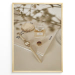 Load image into Gallery viewer, Fashion Plakat | Chanel No. 5 Perfume Flat Lay with Watch and Books – Neutral Aesthetic Print Plakaty.dk | Flat lay of Chanel No. 5 perfume bottle, gold watch, ring, and decorative shell on fashion books with soft floral blur in neutral tones.
