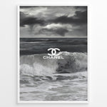 Load image into Gallery viewer, Fashion Plakat | Chanel Ocean Wave Black &amp; White Fashion Poster Plakaty.dk | Black and white ocean wave poster with the Chanel logo centered over crashing waves and a stormy sky.
