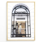 Load image into Gallery viewer, Fashion Plakat | Chanel Storefront Window – Fashion Photography Print Plakaty.dk | Photograph of a Chanel boutique storefront window with elegant black framing and luxury fashion items on display.
