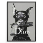 Load image into Gallery viewer, Fashion Plakat | Dior Guard Dog Poster – Bold Fashion Statement Wall Art Plakaty.dk | Black and white image of a Doberman dog holding a handgun in its mouth, wearing a Dior collar, with &quot;Dior&quot; text overlayed – a bold, edgy luxury fashion print.
