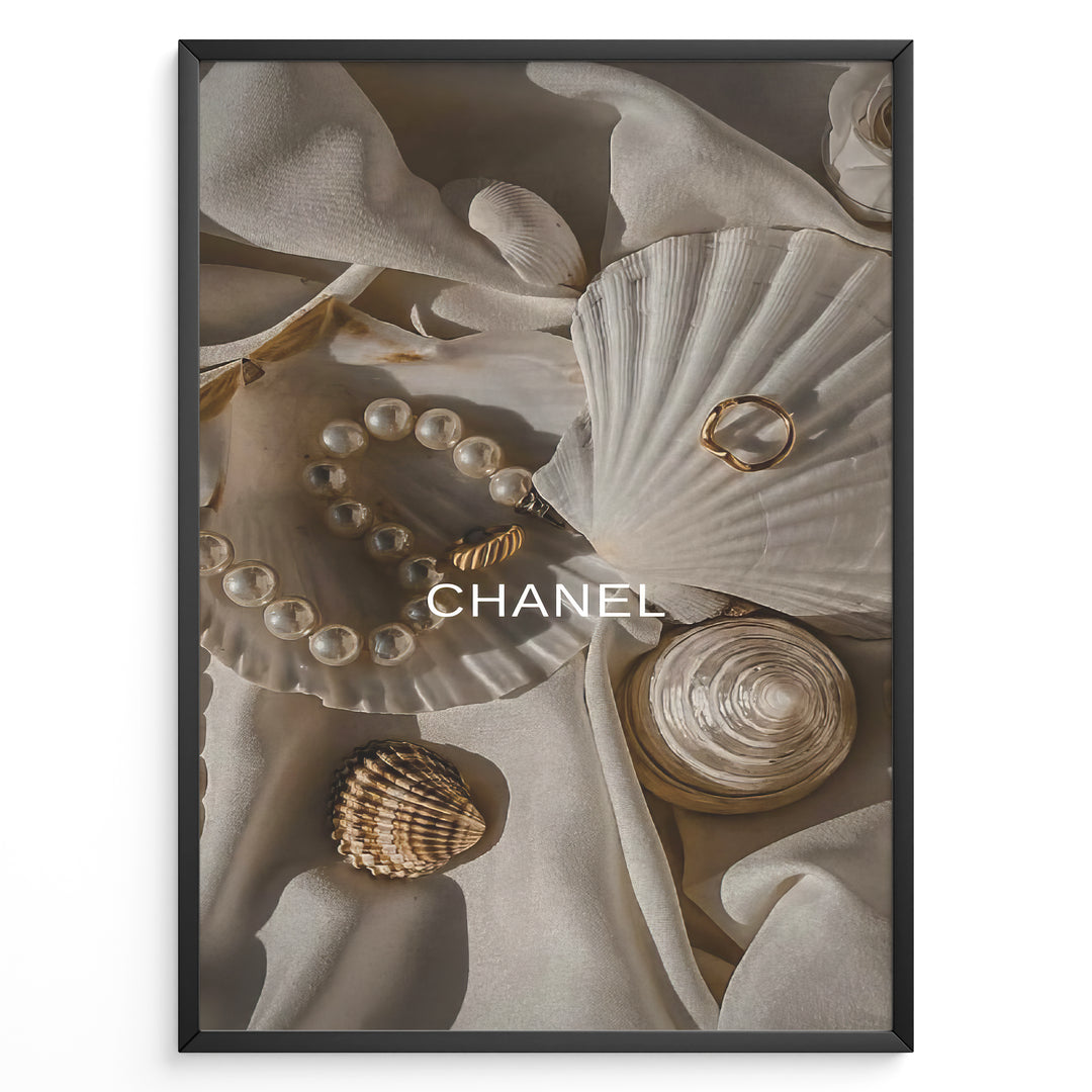 Fashion Plakat | Elegant Chanel-Inspired Flat Lay with Seashells and Jewelry Plakaty.dk | Flat lay of elegant seashells, a pearl bracelet, and gold jewelry on soft ivory fabric with the Chanel logo centered.