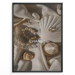 Load image into Gallery viewer, Fashion Plakat | Elegant Chanel-Inspired Flat Lay with Seashells and Jewelry Plakaty.dk | Flat lay of elegant seashells, a pearl bracelet, and gold jewelry on soft ivory fabric with the Chanel logo centered.

