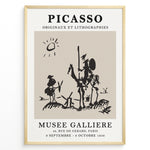 Load image into Gallery viewer, Framed Picasso Don Quixote art poster with minimalist black sketch of riders and windmills on a beige background.
