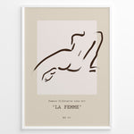 Load image into Gallery viewer, Framed “La Femme No.07” poster with minimalist brown line art of a reclining female silhouette on a beige and blush background.
