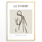 Load image into Gallery viewer, Framed “La Femme No.1” poster with minimalist brown line art of a woman’s back draped in fabric on a beige background.
